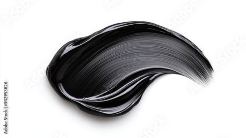 A black liquid with a brush stroke on a white background. The brush stroke is long and curvy, giving the impression of a flowing liquid