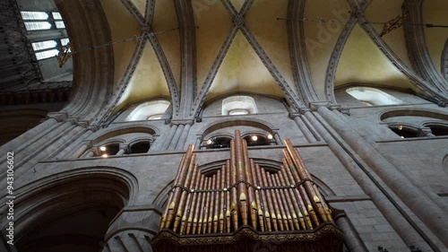 Static mid shot looking up at the roof and organ pipes in Durham Cathedral, Durham, England 