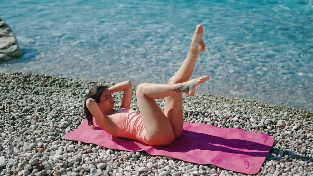 A Woman Doing Exercising by the Beautiful Beach Embracing Fitness and Natures Beauty A Woman Doing Exercising by the Beautiful Beach Embracing Fitness and Natures Beauty