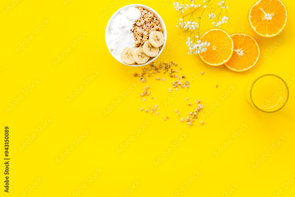 food for healthy breakfast with granola and fresh orange juice on bright yellow background top view mock up food for healthy breakfast with granola and fresh orange juice on bright yellow background top view mock up