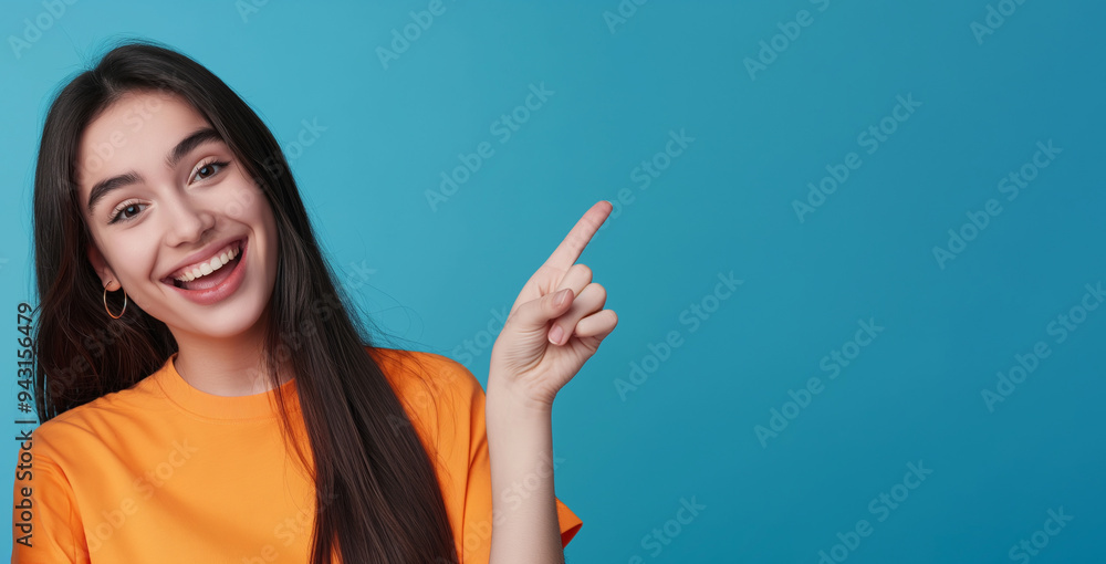 Cheerful young woman pointing the copy space. Cheerful young woman pointing the copy space.