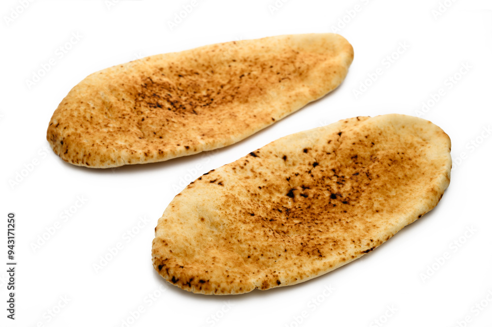 whole greek pita bread isolated on white background whole greek pita bread isolated on white background