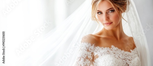 Elegant bride in lace dress and veil, radiating happiness and beauty in soft light, perfect for wedding themes and inspirations.
