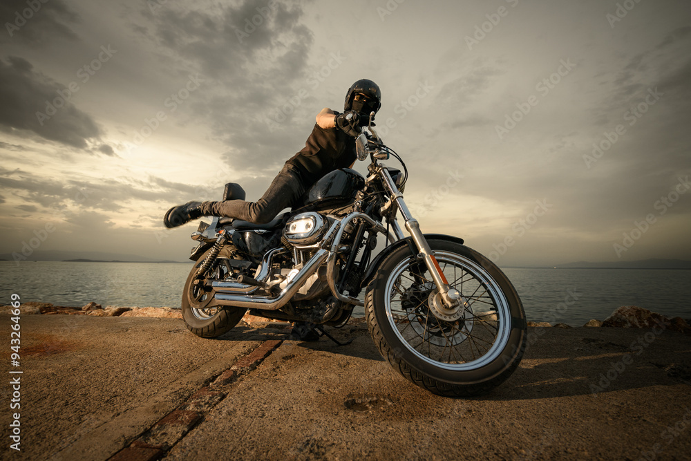 Biker on Chopper Motorcycle at Sunset.. Biker on Chopper Motorcycle at Sunset..