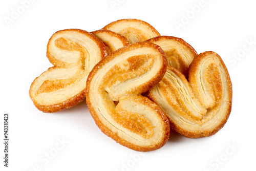 Lots of cookie ears on a white background. Pile of sweet cookies isolated.