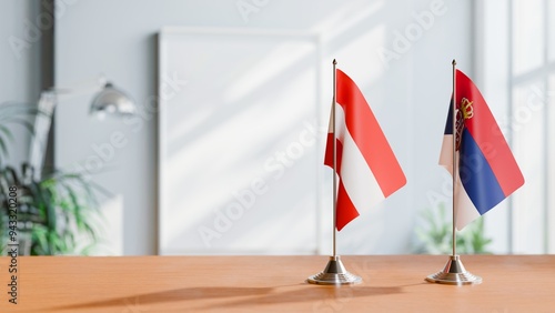 FLAGS OF AUSTRIA AND SERBIA ON TABLE