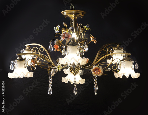 Obraz na płótnie Chandelier lamp with flowers and metal, Bohemian glass Beautiful exquisite natural motifs with crystals on a black background isolate w salonie