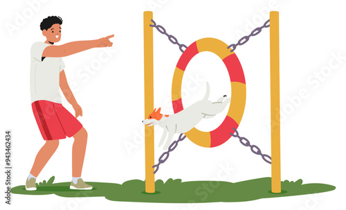 Man Owner Character Points As He Trains His Dog To Jump Through A Hoop Outdoors. The Dog Is Mid-jump