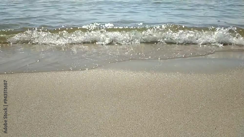 Sea waves roll onto wet sand. Seaside vacation. Clean water. Sea waves roll onto wet sand. Seaside vacation. Clean water.