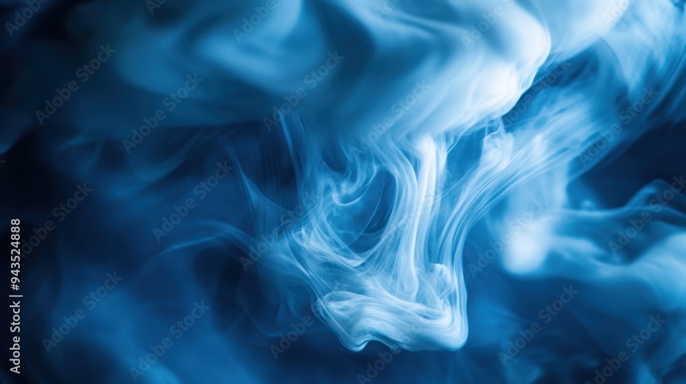 Fototapeta premium Ethereal Blue Smoke Swirls on Dark Background for Artistic Effect