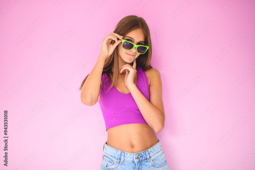 portrait of a 14 years old teen girl close to a white wall with colored shirt and glasses portrait of a 14 years old teen girl close to a white wall with colored shirt and glasses