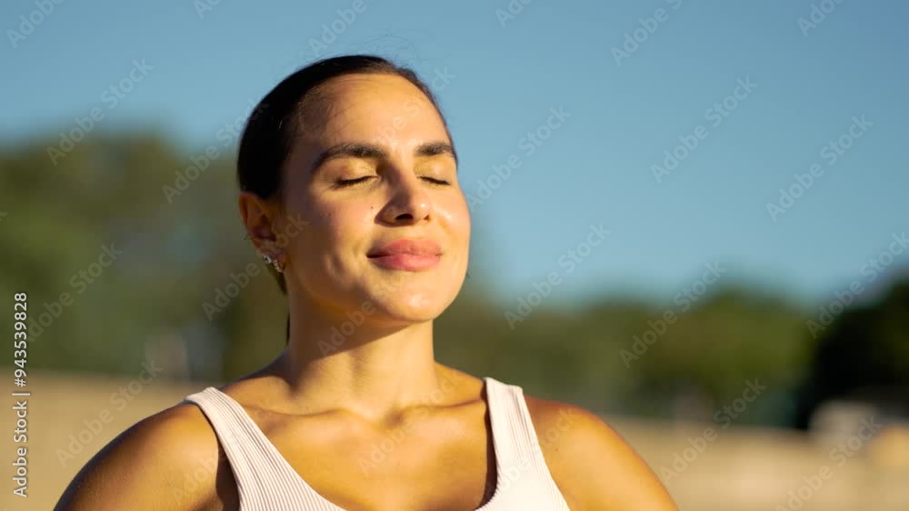 Composed athlete inhales deeply, basking in the golden glow of the afternoon sun post-training. A detailed portrait capturing a moment of respite and refreshment during a rigorous fitness routine Composed athlete inhales deeply, basking in the golden glow of the afternoon sun post-training. A detailed portrait capturing a moment of respite and refreshment during a rigorous fitness routine