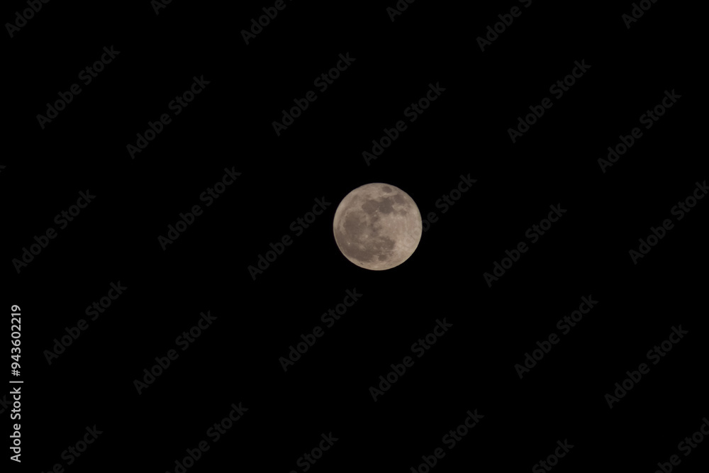 Moon Closeup Showing the Details of Lunar Surface. Cloudy Sky. Moon Closeup Showing the Details of Lunar Surface. Cloudy Sky.