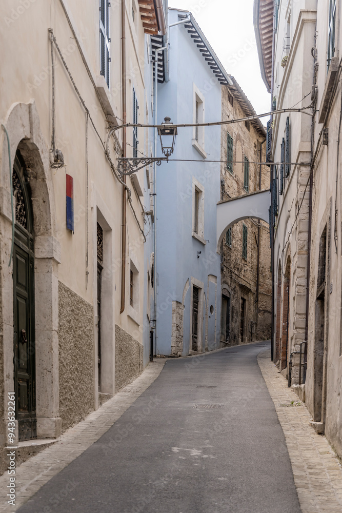 Fototapeta premium narrow uphill street at medieval hilltop little town, Amelia, Italy