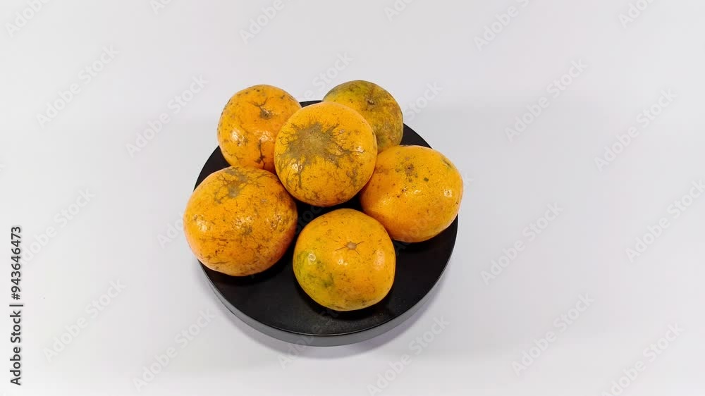 Stack of Oranges on a Black Pedestal, Against a White Background: A Bold Contrast Between the Vibrant Citrus Fruits and the Dark Pedestal, Highlighting the Natural Beauty of the Oranges Stack of Oranges on a Black Pedestal, Against a White Background: A Bold Contrast Between the Vibrant Citrus Fruits and the Dark Pedestal, Highlighting the Natural Beauty of the Oranges