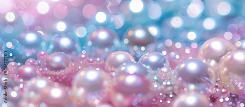 a stunning array of vibrant blue and pink shiny pearls on a gentle pink background with copy space