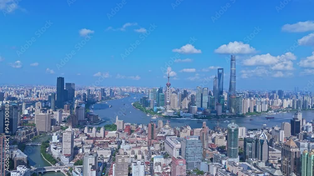 Shanghai, China - August 17th 2024: 4k real time aerial view of high-rise buildings over Huangpu River in sunny day with blue sky Shanghai, China - August 17th 2024: 4k real time aerial view of high-rise buildings over Huangpu River in sunny day with blue sky