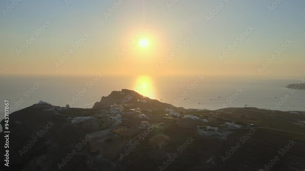 Aerial view at sunset of the volcano coasts of Santorini island in Greece Aerial view at sunset of the volcano coasts of Santorini island in Greece