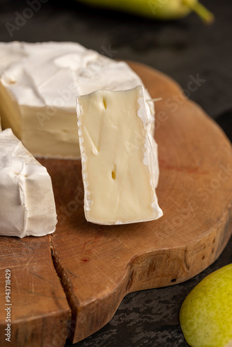 soft processed cheese with edible white mold photo