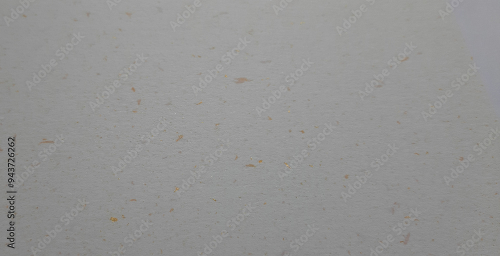 cream paper texture with gold or copper particles, abstract background close-up surface with space for design
