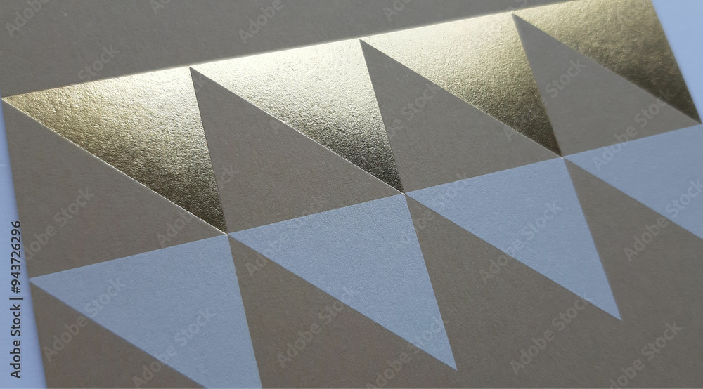 close-up of an abstract sand color paper texture with triangles in gold and white printed on the surface, textured background and beautiful wallpaper with space for design close-up of an abstract sand color paper texture with triangles in gold and white printed on the surface, textured background and beautiful wallpaper with space for design