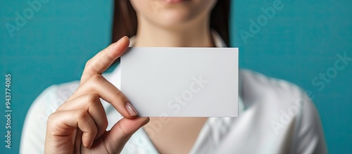 A woman s hand is holding a...