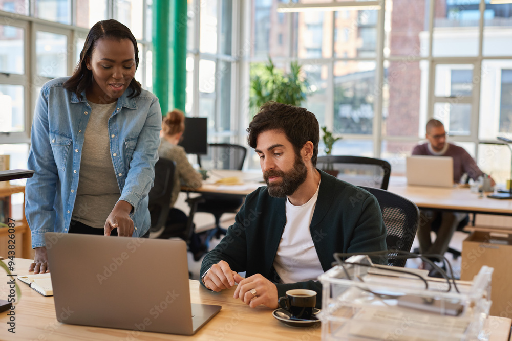 custom made wallpaper toronto digitalTwo diverse young businesspeople working together on a laptop
