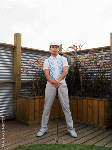 Portrait of Man Holding Golf Club photo