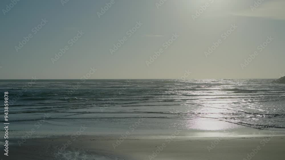 serene ocean view at sunset with gentle waves reflecting the soft glow of the setting sun serene ocean view at sunset with gentle waves reflecting the soft glow of the setting sun