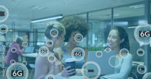 Wallpaper Mural 6G technology animation over diverse businesswomen collaborating in modern office Torontodigital.ca