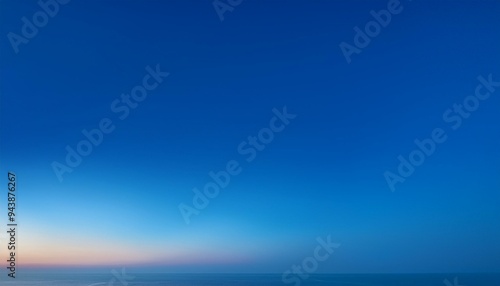 a gradient blue background with soft transitions from light to dark blue, resembling the serene hues of a clear sky at dusk.