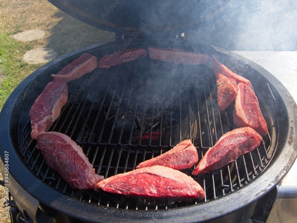 Picanha, or top sirloin cap, steaks on a charcoal grill