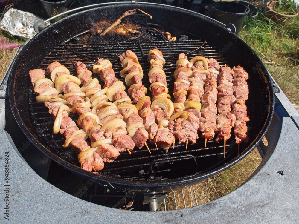 Shish kebab on a wooden skewers on a charcoal grill