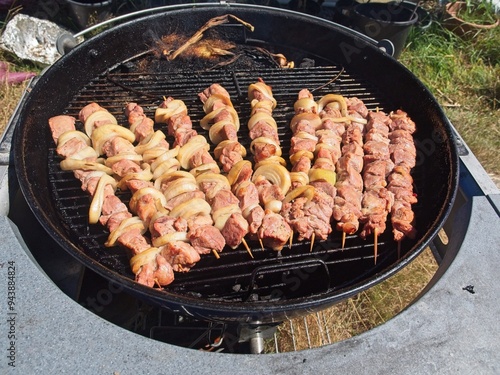 Shish kebab on a wooden skewers on a charcoal grill