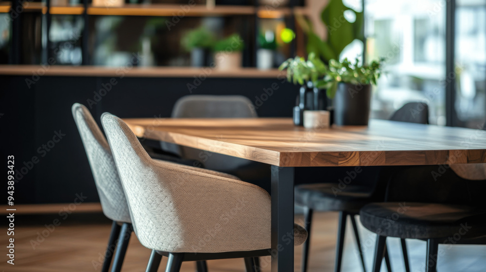Close-Up of Modern Dining Room with Wooden Table, Chairs, and Black Cabinet Close-Up of Modern Dining Room with Wooden Table, Chairs, and Black Cabinet