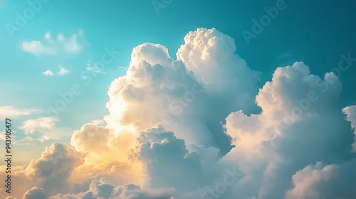 Obraz Cudowne niebo wypełniają białe cumulusowe chmury, które unoszą się leniwie na tle spokojnego, błękitnego nieba. 