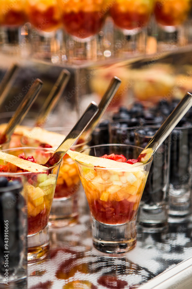 Close-up of Glasses of Fruit Cocktail and Shot Glasses of Blueberries on Dessert Table Close-up of Glasses of Fruit Cocktail and Shot Glasses of Blueberries on Dessert Table