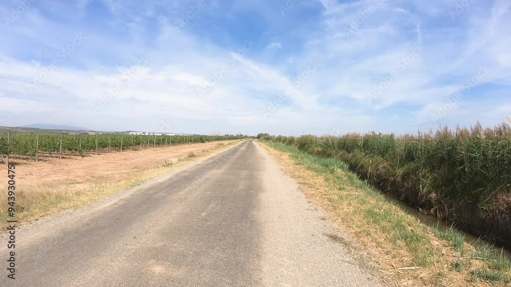 Camino del Ebro - a paved road through agricultural fields next to Calahorra, province of La Rioja, Spain Camino del Ebro - a paved road through agricultural fields next to Calahorra, province of La Rioja, Spain