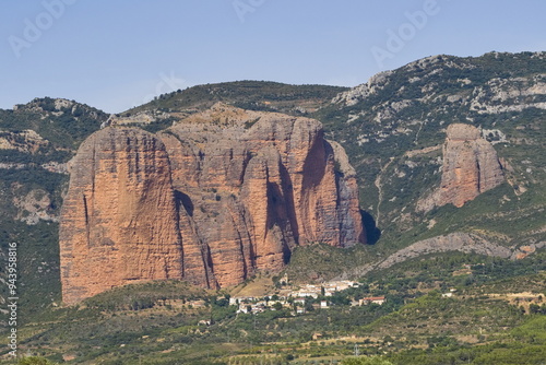 spectacular natural monument of the mallos de riglos with the village of riglos below photo