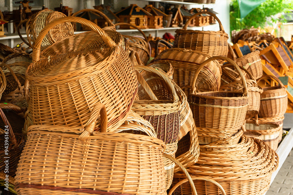 Many large and small baskets are lying on the market counter. Many large and small baskets are lying on the market counter.