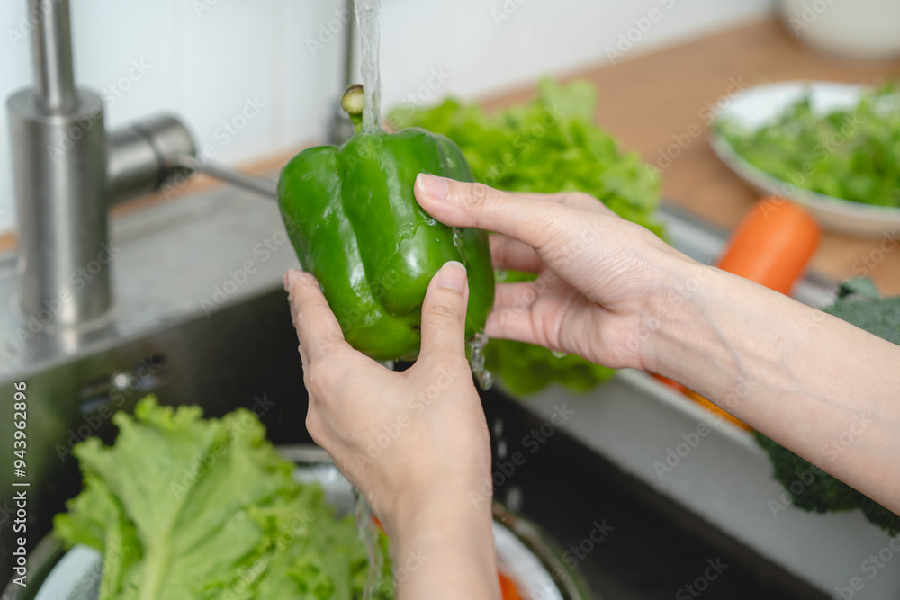 people washing raw vegetables at sink in the kitchen prepare ingredient for cooking people washing raw vegetables at sink in the kitchen prepare ingredient for cooking
