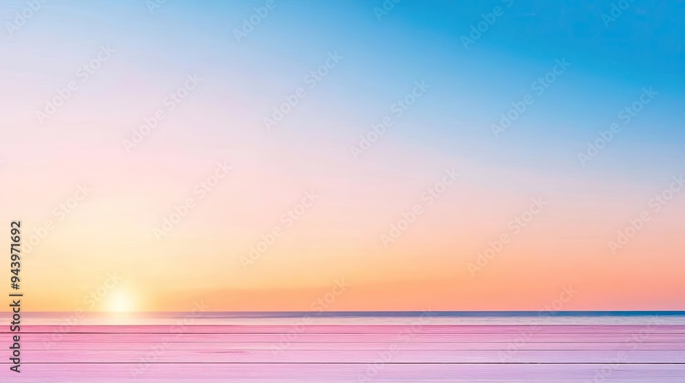 Obraz premium A serene sunrise over the calm ocean, showcasing vibrant colors in the sky and reflections on the water, perfect for relaxation.