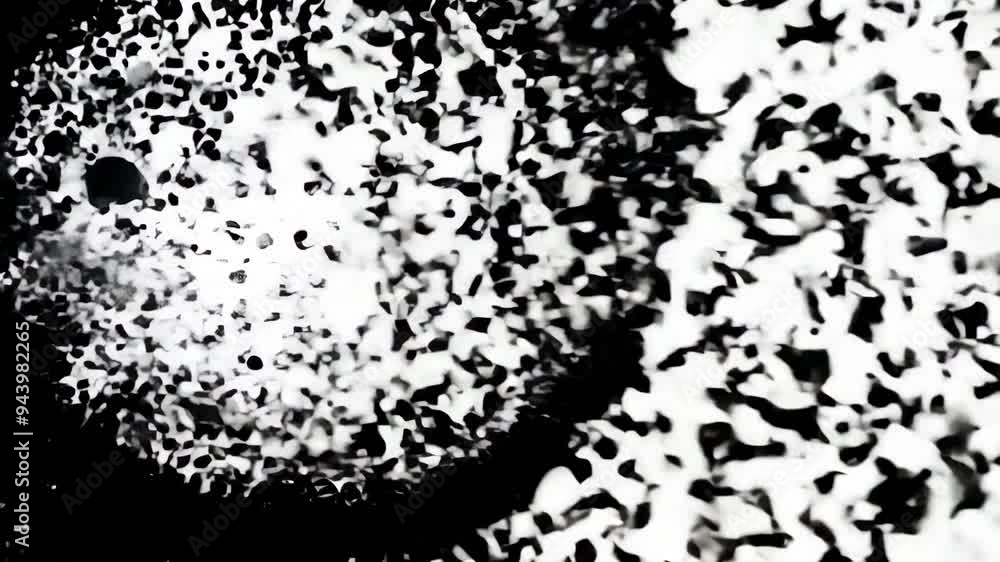 Black ink droplets creating abstract patterns on a white surface during an art demonstration at a local gallery Black ink droplets creating abstract patterns on a white surface during an art demonstration at a local gallery
