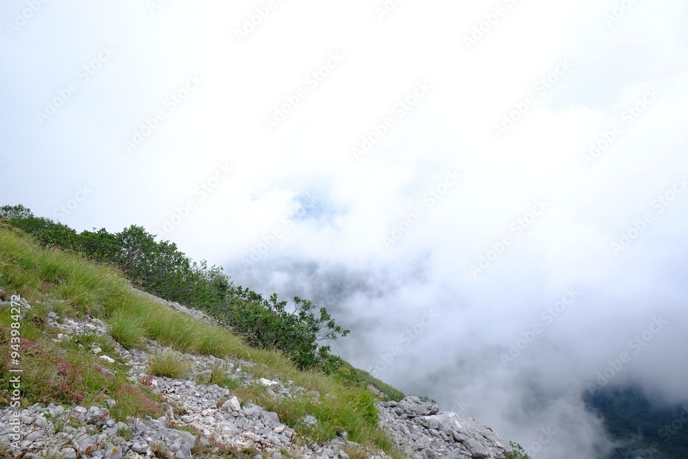 Picturesque view of rocky mountains covered with clouds Picturesque view of rocky mountains covered with clouds