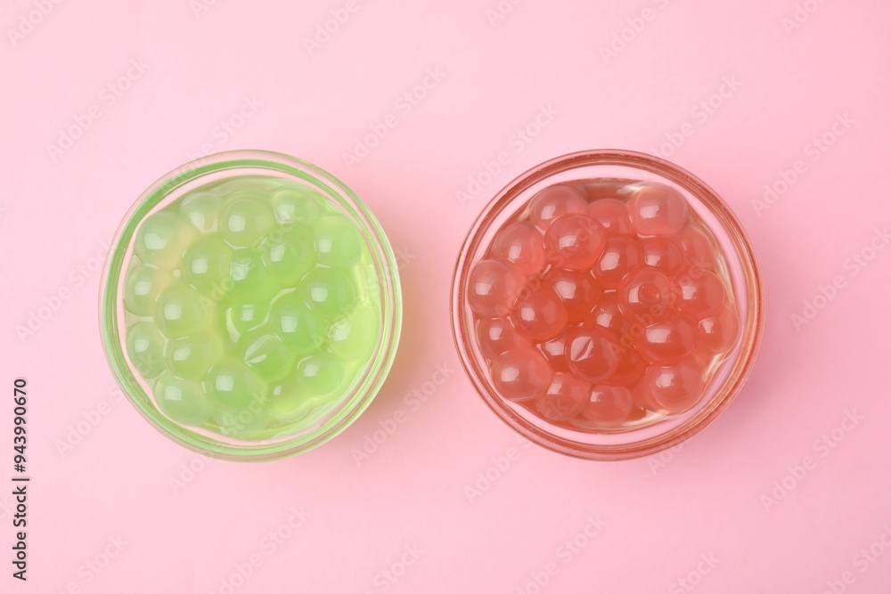 Bright tapioca pearls in bowls on pink background, flat lay Bright tapioca pearls in bowls on pink background, flat lay