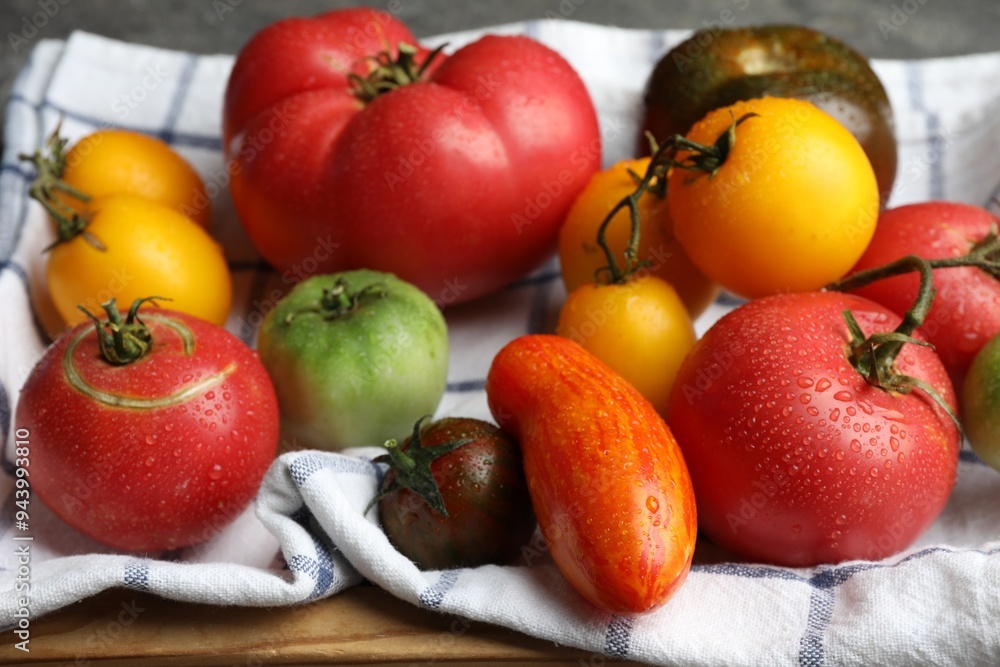 Different ripe and unripe tomatoes on table, closeup Different ripe and unripe tomatoes on table, closeup