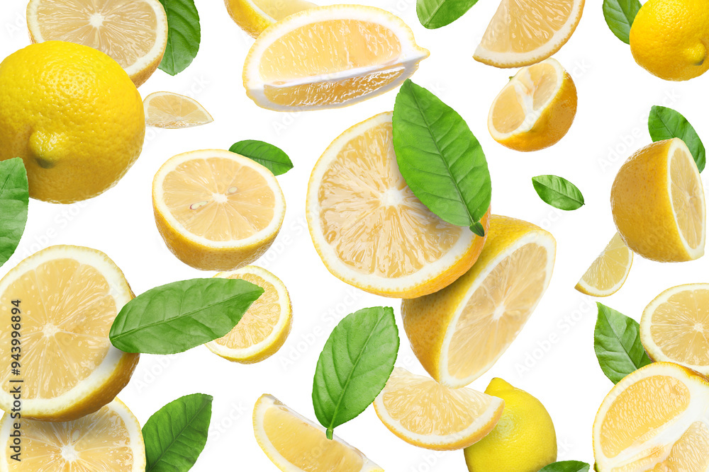 Fresh juicy lemons and green leaves falling on white background Fresh juicy lemons and green leaves falling on white background