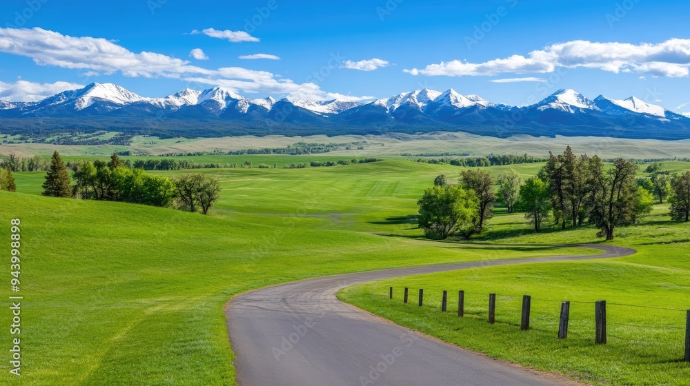 Majestic mountains rise in the background while the vibrant valley unfolds below, filled with green trees and a clear blue sky scattered with white clouds Majestic mountains rise in the background while the vibrant valley unfolds below, filled with green trees and a clear blue sky scattered with white clouds
