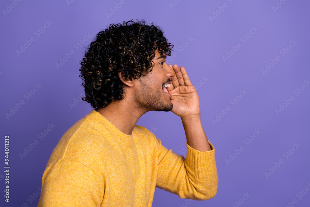 Photo of cheerful funny man wear trendy yellow clothes say tell news empty space isolated on violet color background Photo of cheerful funny man wear trendy yellow clothes say tell news empty space isolated on violet color background