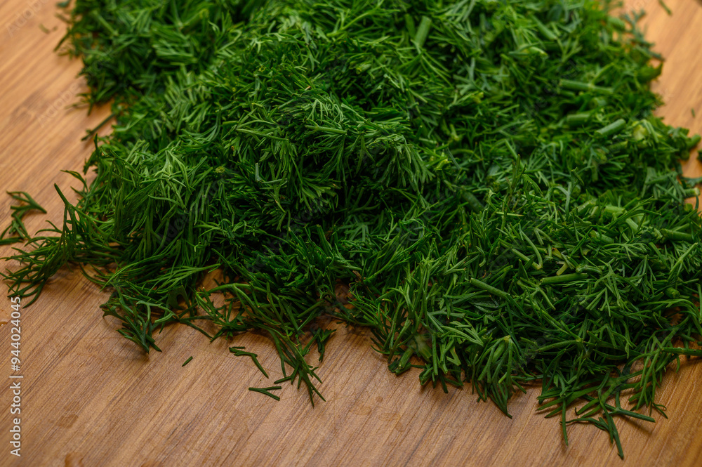 Bunch of fresh organic dill on a rustic wooden background. Bunch of fresh organic dill on a rustic wooden background.